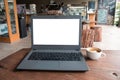 Closeup of laptop computer with blank display in coffee shop concept image made advertised product.