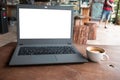 Closeup of laptop computer with blank display in coffee shop concept image made advertised product. Royalty Free Stock Photo