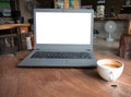 Closeup of laptop computer with blank display in coffee shop concept image made advertised product. Royalty Free Stock Photo