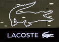 Closeup of Lacoste sign on store front, Lacoste