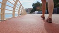 Closeup of lady legs walking along unpolluted pavement, concept of clean city