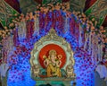 Closeup , landscape view of decorated and garlanded Isolated idol Hindu God Ganesha in Pune ,Maharashtra, India
