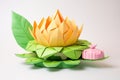 closeup of large origami lotus on lily pad model