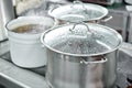 Closeup of large pots on the stove. Chef cooking at commercial kitchen - hot job. real dirty restaurant kitchen. Royalty Free Stock Photo