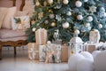 Closeup of a large stack of wrapped Christmas presents of varying sizes and shapes in Xmas interior. Royalty Free Stock Photo