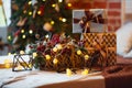 Closeup of a large stack of wrapped Christmas presents of varying sizes and shapes in Xmas interior. Royalty Free Stock Photo