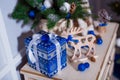 Closeup of a large stack of wrapped Christmas presents of varying sizes and shapes in Xmas interior. Royalty Free Stock Photo