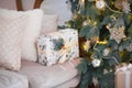 Closeup of a large stack of wrapped Christmas presents of varying sizes and shapes in Xmas interior. Royalty Free Stock Photo