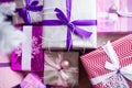 Closeup of a large stack of wrapped Christmas presents of varying sizes and shapes in Xmas interior. Royalty Free Stock Photo