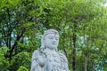 Closeup of large stone carved seated Buddha