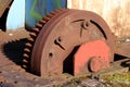 Closeup of large vintage old railway turntable or wheelhouse cogwheel mounted on side of railroad tracks