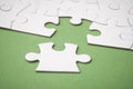 The last piece of jigsaw puzzle missing on green background to complete the mission Royalty Free Stock Photo