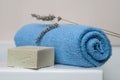 lavender soap and rolled blue towel in the bathroom Royalty Free Stock Photo