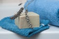 lavender soap on washcloth and rolled blue towel in t Royalty Free Stock Photo