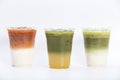 Closeup of layered drinks iced tea group thai milk tea matcha latte and yuzu green tea in plastic glass isolated white background Royalty Free Stock Photo