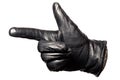 Closeup black leather glove, fingers showing gun, shoot sign. Isolated on white background. Concept symbols, signs, numbers