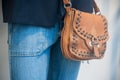 Leather handbag and blue jeans trousers on mannequin Royalty Free Stock Photo