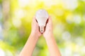 Closeup LED lighting bulb in hands Royalty Free Stock Photo