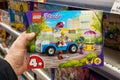 Closeup of Lego box in hand of buyer in a toy store supermarket. Minsk, Belarus, 2023