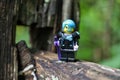 Closeup of a Lego minifigure of the Cyborg superhero on a wooden surface