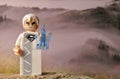 Closeup of a Lego minifigure of the Jor-El fictional character on a rocky surface