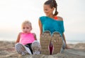 Closeup on legs of fitness mother and baby girl Royalty Free Stock Photo