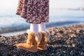 Closeup of legs little girl in cozy fur boots Royalty Free Stock Photo