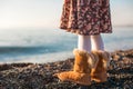 Closeup of legs little girl in cozy fur boots Royalty Free Stock Photo