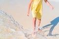 Closeup legs of little girl at shallow water Royalty Free Stock Photo