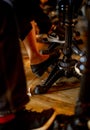 Closeup legs of a man and a woman under the table at coffee shop. Vintage style table in restaurant. People chill out Royalty Free Stock Photo