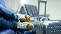 Feet and shoes of a young hipster passenger taking nap near the gate while waiting for connection or delayed flight