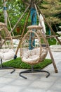 Closeup of leisure rattan hanging chair outdoors Royalty Free Stock Photo