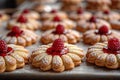 A closeup of lemon cookies with raspberry jam, placed on an oiled baking sheet Royalty Free Stock Photo