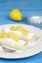 Closeup lemon crepes with sugar and fork