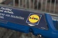 Closeup of Lidl supermarket trolleys alignment on the parking