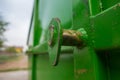 Closeup Lifting with rust of big dumpster garbage truck