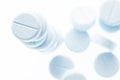 Closeup light blue pills on white background,shallow depth of field. Royalty Free Stock Photo