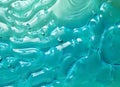 Closeup of light blue transparent clear calm water surface texture Royalty Free Stock Photo