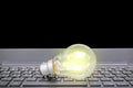 Closeup light bulb on keyboard laptop, Light bulbs with new ideas, innovation, inspiration and creativity concept Royalty Free Stock Photo