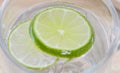 Closeup lime in glass of soda