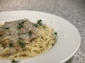 Linguine with white sauce in wide-rimmed bowl