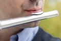 Closeup of lips playng a flute. Royalty Free Stock Photo