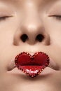 Closeup lips with red heart make-up & rhinestones. Valentines Day style Royalty Free Stock Photo