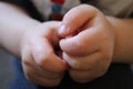 Closeup of a little boys hands with blurry backgound