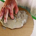 Closeup of little child`s hands working with clay, play dough, on a school or kindergarten activity - learning by doing, education Royalty Free Stock Photo