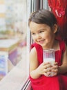 Closeup of little girl drinking milk Royalty Free Stock Photo