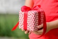 Closeup little girl holding a gift box. Holidays, present