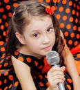 Closeup little girl with microphone