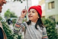 Closeup of a little girl playing with her father after school. Dad enjoying the time together with his child outside. Daddy and Royalty Free Stock Photo