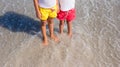 Closeup of little girls legs at shallow water Royalty Free Stock Photo